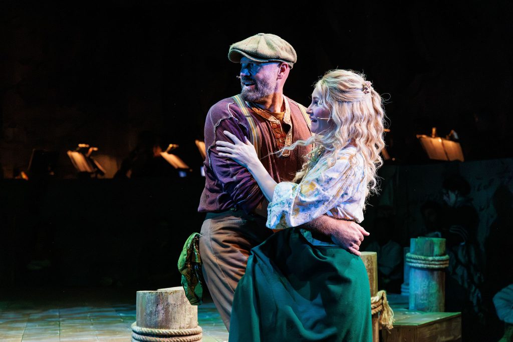 Zachary James as Billy Bigelow and Heather Botts as Julie Jordan in The REV Theatre Company’s production of Rodgers & Hammerstein’s CAROUSEL – The REV Theatre Co. | Broadway in the Finger Lakes Zachary James as Billy Bigelow and Heather Botts as Julie Jordan in The REV Theatre Company’s production of Rodgers & Hammerstein’s CAROUSEL