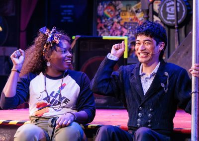 Wonu Ogunfowora as Regina and Romelo Urbi as Franz in The REV Theatre Company’s production of ROCK OF AGES.