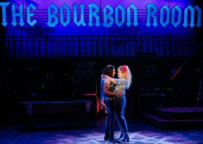 Noah Mutterperl as Drew and Maggie Gidden as Sherrie in The REV Theatre Company’s production of ROCK OF AGES.